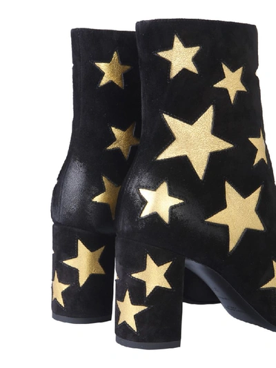 Shop Saint Laurent Lou Star Print Ankle Boots In Nero