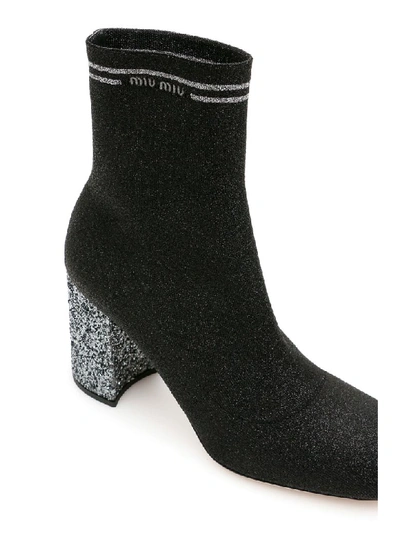 Shop Miu Miu Glitter Sock Booties In Nero Cromo (black)