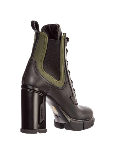 Shop Prada Opanca Heeled Ankle Boots In Nero