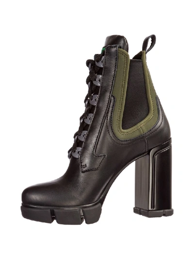 Shop Prada Opanca Heeled Ankle Boots In Nero