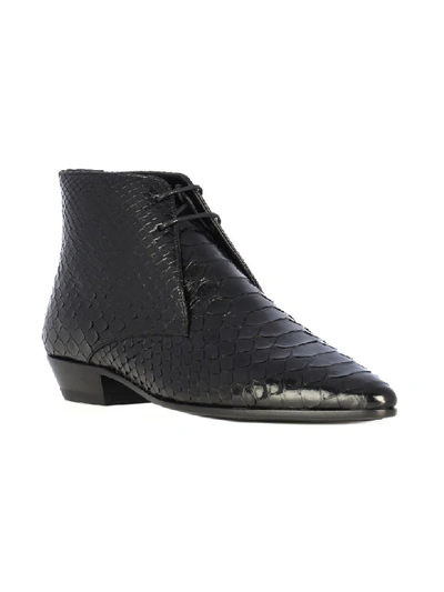 Shop Saint Laurent Jonas 25 Python Lace Up Low Boots In Black