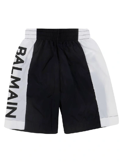 Shop Balmain Printed Logo Swim Shorts In Black/white