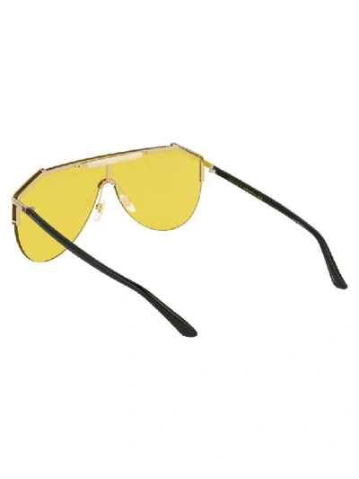 Shop Gucci Sunglasses In Gold Black Yellow