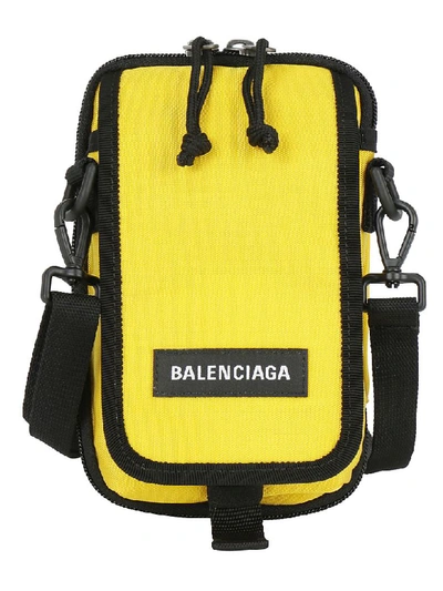 Shop Balenciaga Explorer Cross Body Pouch In Yellow