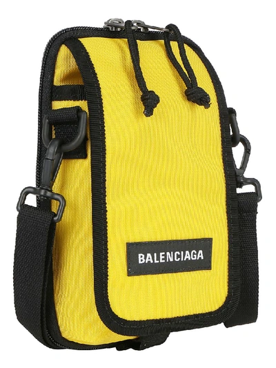 Shop Balenciaga Explorer Cross Body Pouch In Yellow