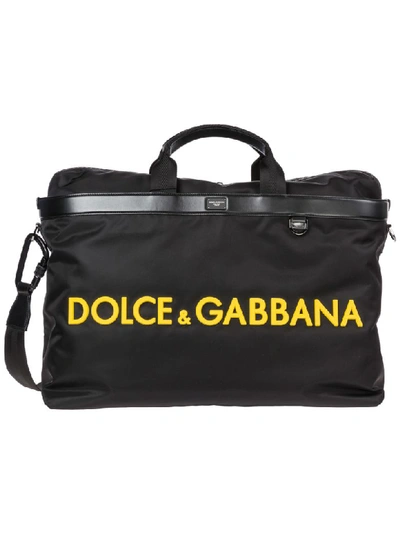 Shop Dolce & Gabbana Logo Duffle Bag In Nero / Giallo