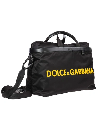 Shop Dolce & Gabbana Logo Duffle Bag In Nero / Giallo