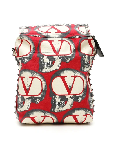 Shop Valentino Undercover Skull Messenger Bag In Rouge Pur Nero (white)