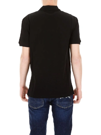 Shop Alexander Mcqueen Skull Patch Polo Shirt In Black (black)