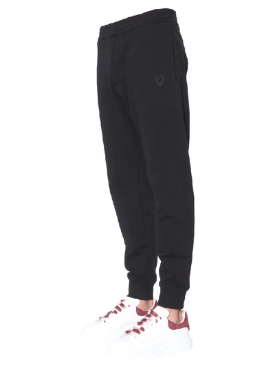 Shop Alexander Mcqueen Jogging Pants With Skull Patches In Nero