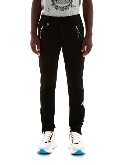 Shop Alexander Mcqueen Joggers With Embroidered Logo In Black (black)