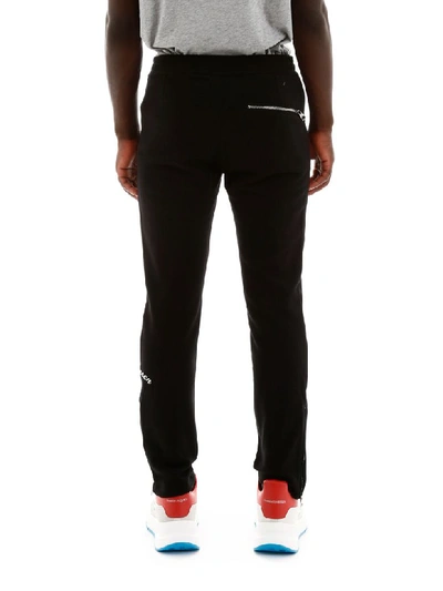 Shop Alexander Mcqueen Joggers With Embroidered Logo In Black (black)