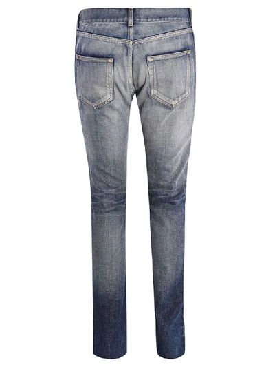 Shop Saint Laurent Skinny Distressed Jeans In Blue