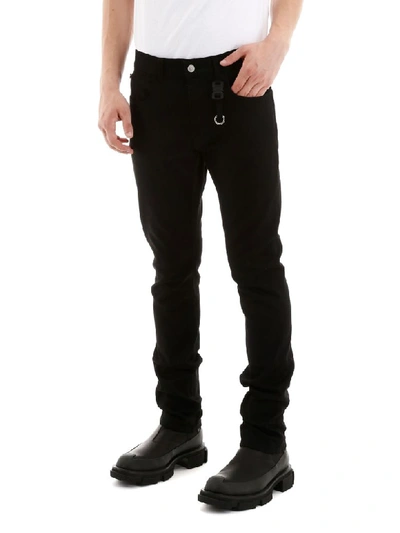 Shop Alyx Buckled Jeans In Black (black)