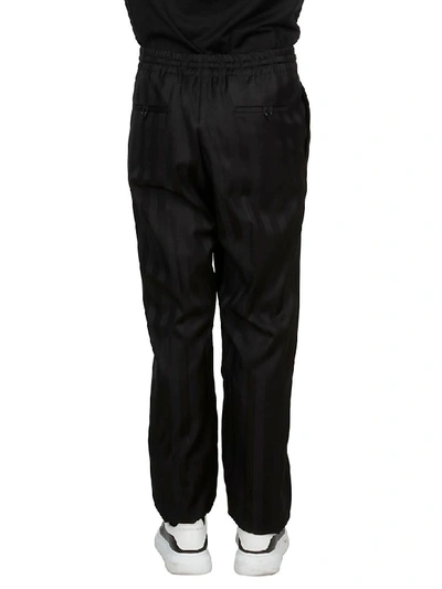 Shop Saint Laurent Belted Straight Trousers In Black