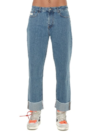 Shop Gcds Wide Fit Logo Jeans In Denim