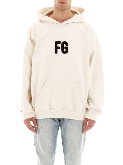 Shop Fear Of God Logo Hoodie In Cream Black (beige)