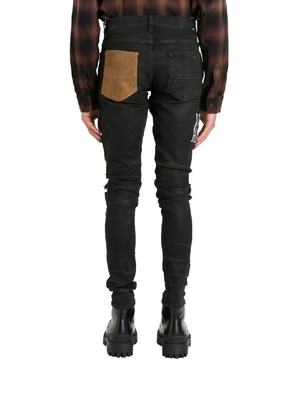 Amiri Grunge Patch Jeans In Nero | ModeSens