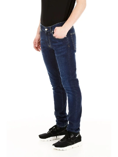 Shop Alexander Mcqueen Jeans With Logo Embroidery In Blu Washed (blue)