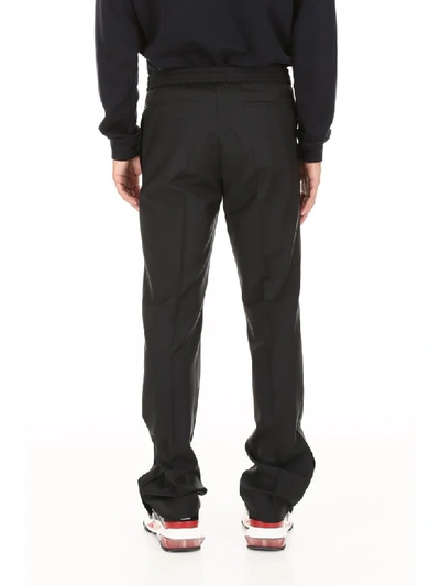Shop Valentino Trousers With Side Bands In Nero Blu (black)