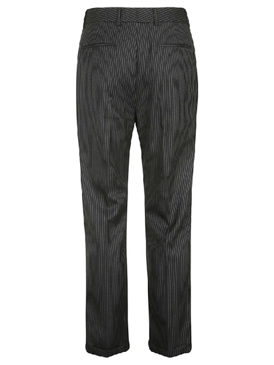 Shop Saint Laurent Striped Trousers In Black