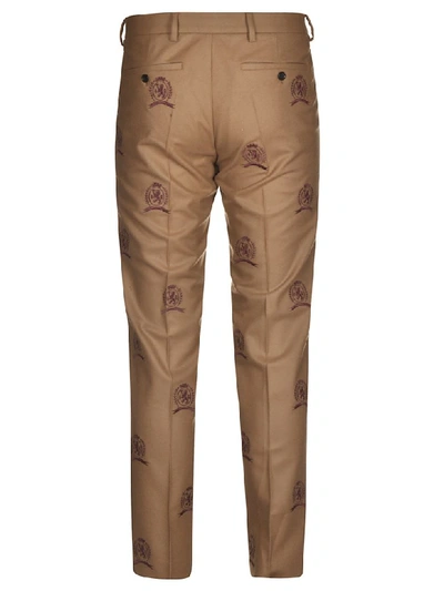 Shop Tommy Hilfiger Embroidered Logo All-over Trousers In Dijon