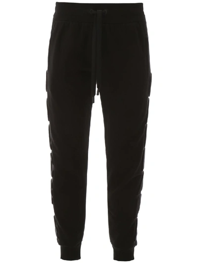 Shop Dolce & Gabbana Joggers With Embossed Logo In Nero (black)