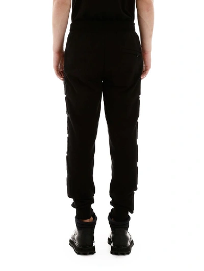 Shop Dolce & Gabbana Joggers With Embossed Logo In Nero (black)