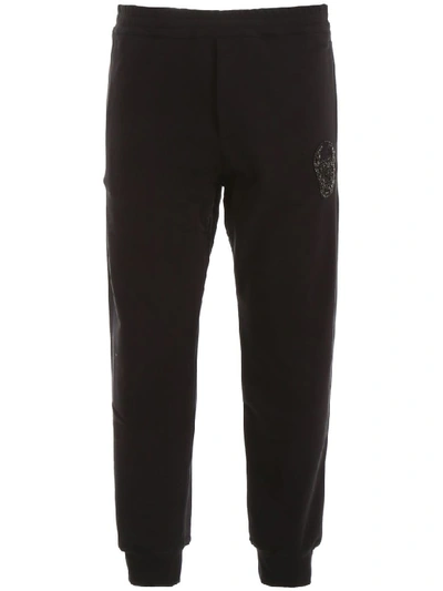 Shop Alexander Mcqueen Joggers With Embroidered Skull In Black (black)
