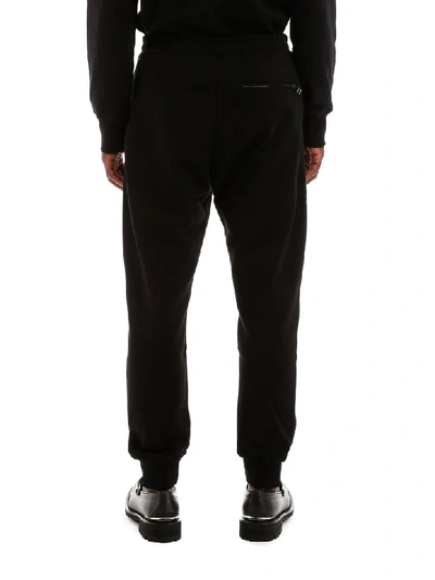 Shop Alexander Mcqueen Joggers With Embroidered Skull In Black (black)