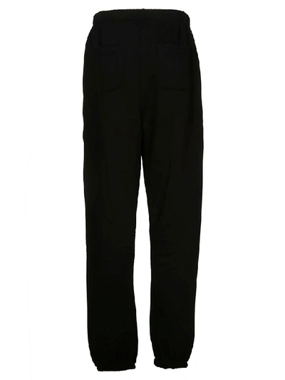 Shop Ih Nom Uh Nit Logo Print Track Pants In Black