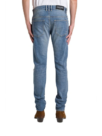 Shop Balmain Distressed Effects Skinny Jeans In Blu