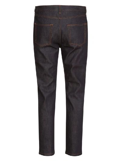 Shop Saint Laurent Straight-cut Jeans With Cuffs In Indigo Raw Denim In Blu