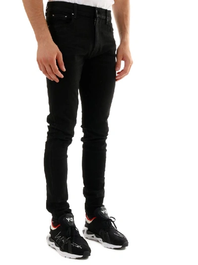 Shop Amiri Skinny Jeans Black