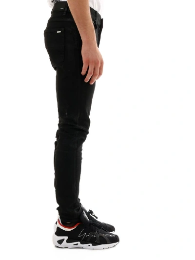 Shop Amiri Skinny Jeans Black