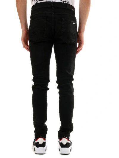 Shop Amiri Skinny Jeans Black