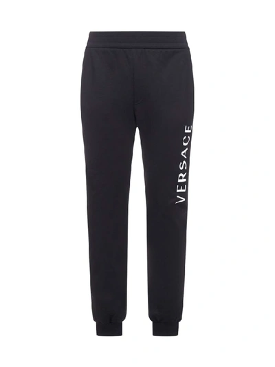 Shop Versace Trousers In Nero