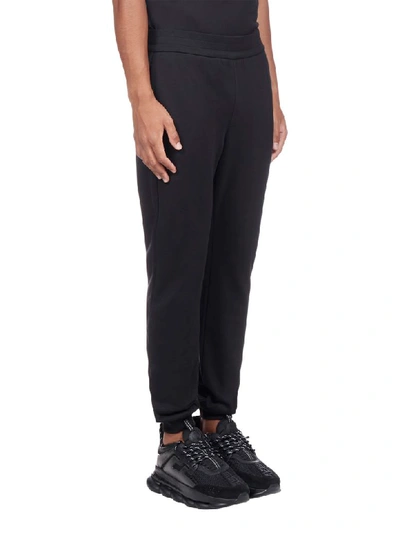 Shop Versace Trousers In Nero