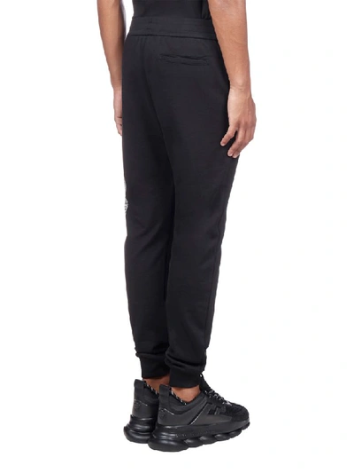 Shop Versace Trousers In Nero