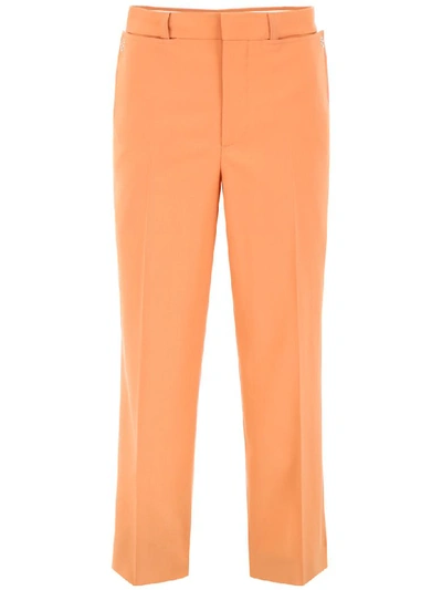 Shop Burberry Draped Wool Trousers In Orange (orange)