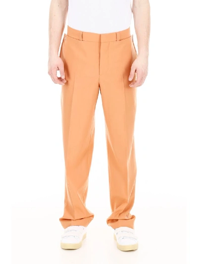 Shop Burberry Draped Wool Trousers In Orange (orange)