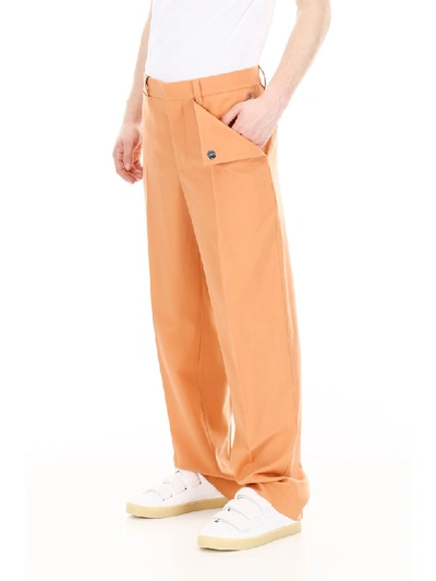 Shop Burberry Draped Wool Trousers In Orange (orange)