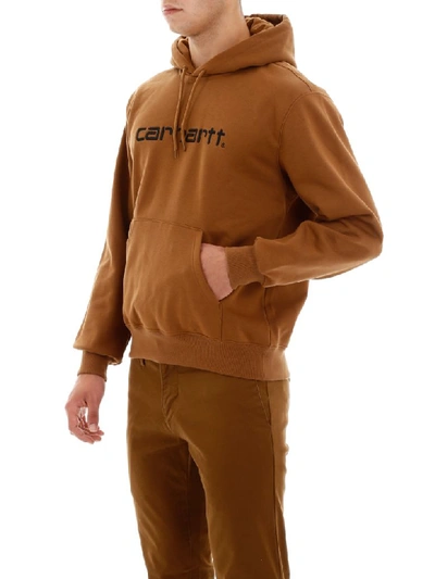 Shop Carhartt Logo Hoodie In Hamilton Brown Black (brown)