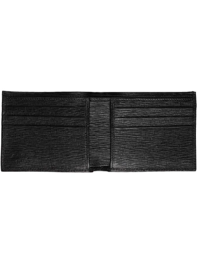 Shop Ferragamo Leather Textured Flap-over Wallet In Black