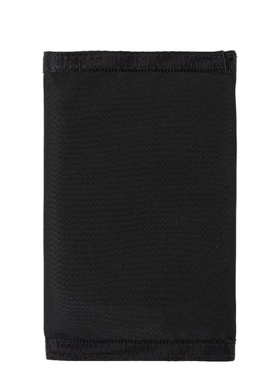 Shop Burberry Logo Print Flap-over Wallet In Black