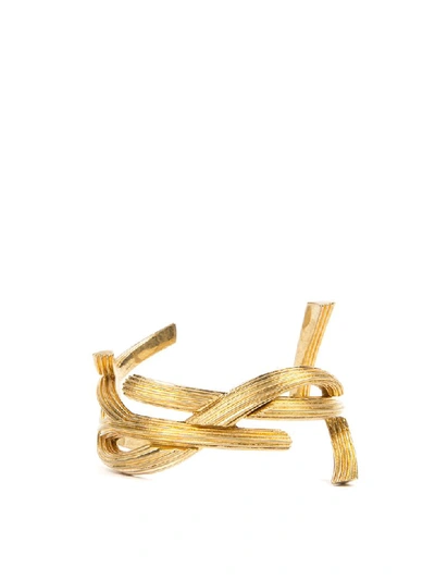 Shop Saint Laurent Rigid Metal Monogram Shaped Bracelet In Gold
