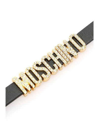 Shop Moschino Crystal Lettering Bracelet In Black (black)