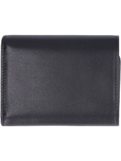 Shop Tod's Leather Small Flap-over Wallet In Black