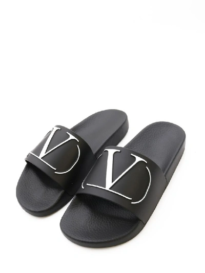 Shop Valentino Slider Sandal Vltn In Black