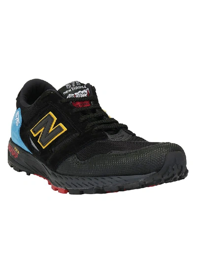Shop New Balance 575 Trail Lifestyle Sneakers In Black/blue